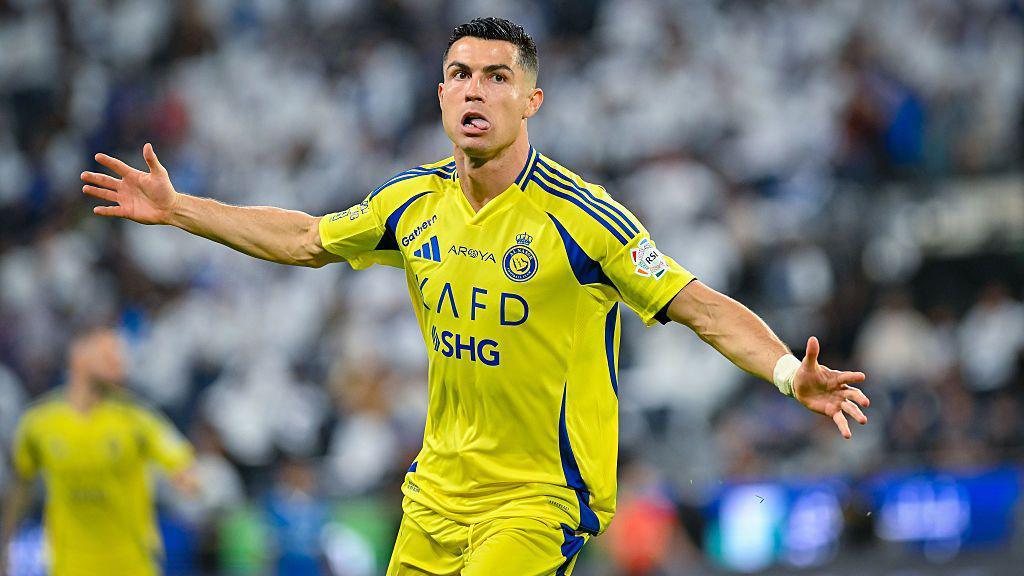  Cristiano Ronaldo of Al-Nassr celebrates aft  scoring a extremity   