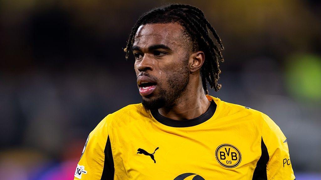 Carney Chukwuemeka looks on in a Borussia Dormund shirt
