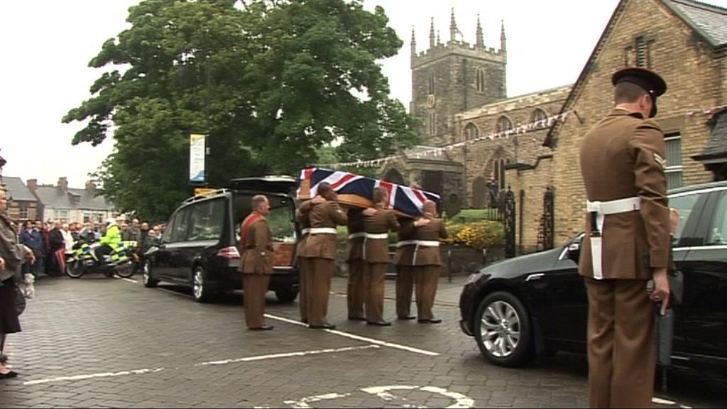 Cortege carrying coffin of Pte Gregg Stone into church