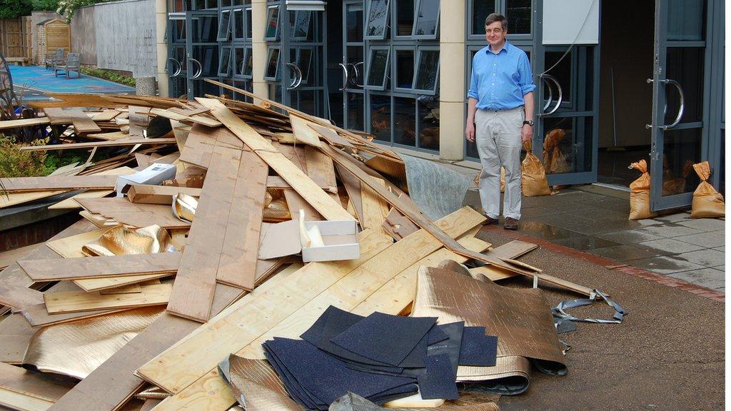 Bernard Trafford looks on at some of the damage caused by the flooding