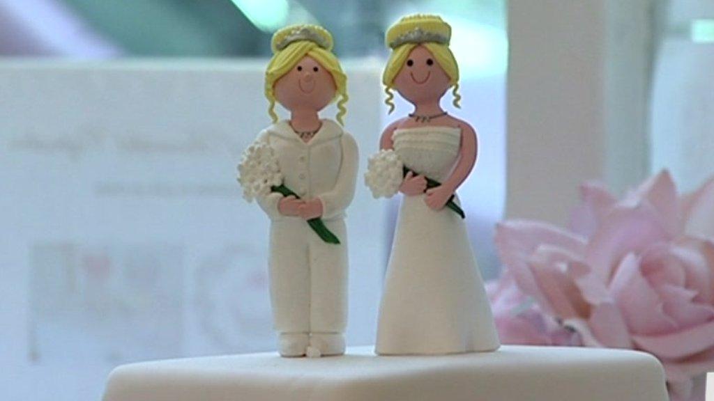 Two women on a wedding cake