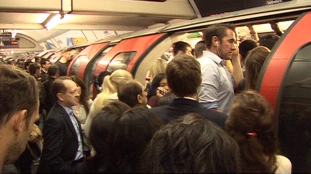 People struggling to get on a Central Line train on Tuesday morning