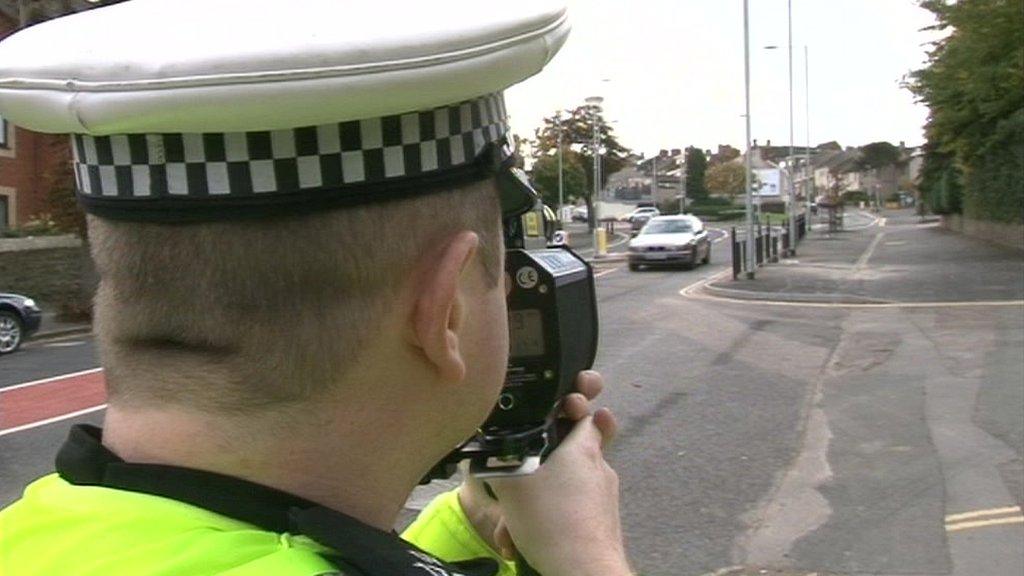 Officer using a speed gun