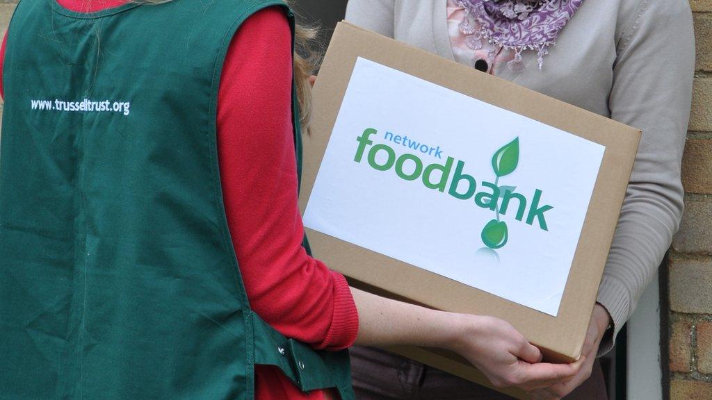 A Trussell Trust volunteer handing out food