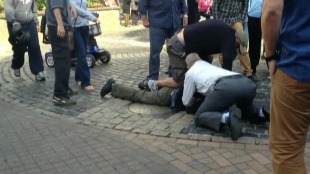 Shoppers hold down a suspect in Didcot