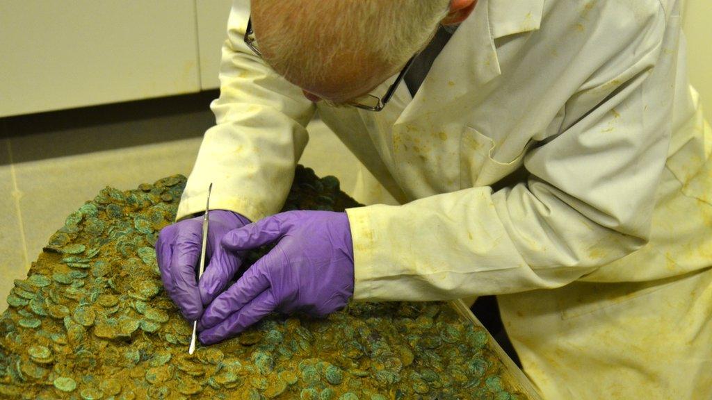 Neil Mahrer working on the coin hoard