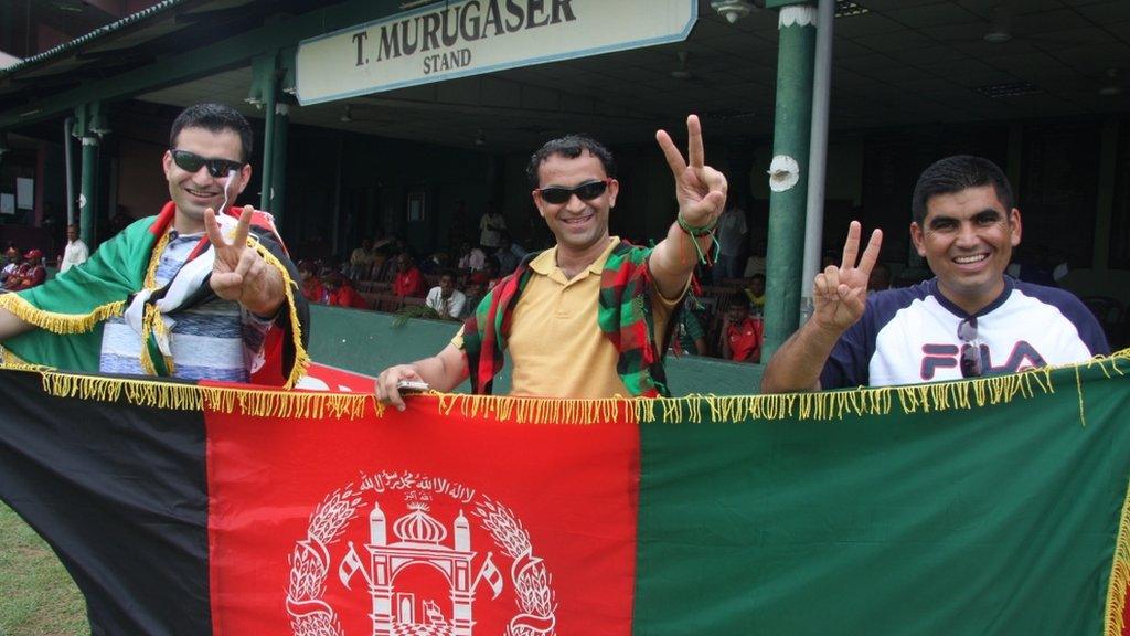 Cricket fans Zia Aryoobi (L) and Ishan Hashimi and Islamudin Aryoobi