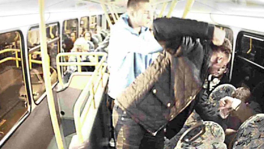 Yob punches man on a bus