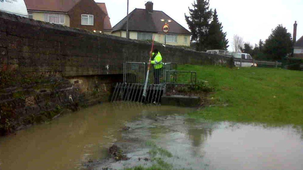 Environment Agency staff clearing out trash near Northampton