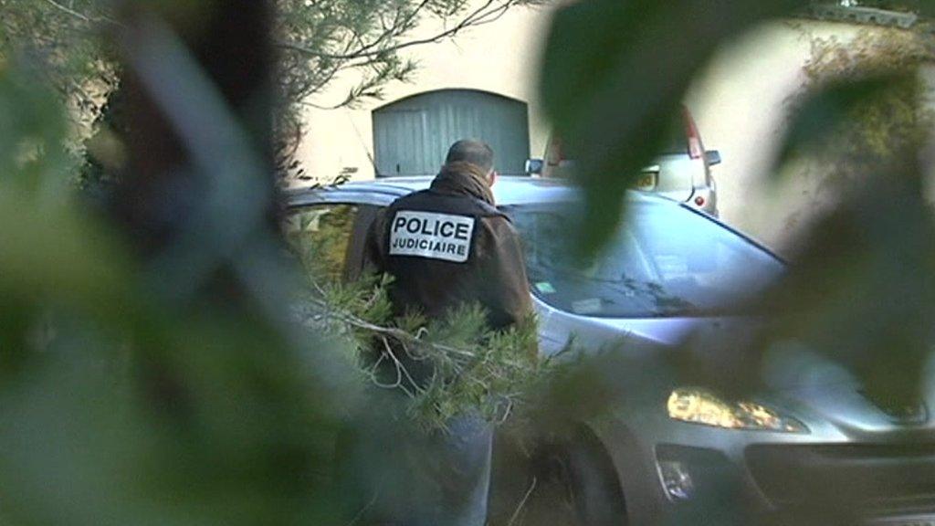 Police outside the house were the murder suspect lives in Nimes