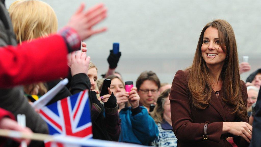 Crowds waving to Duchess of Cambridge