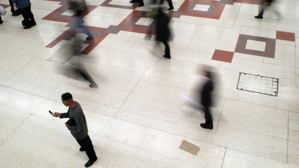 People moving, man with mobile phone