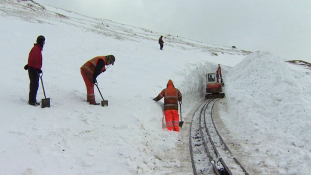 Teams clearing snow on Snowdon Mountain Railway in March, 2013