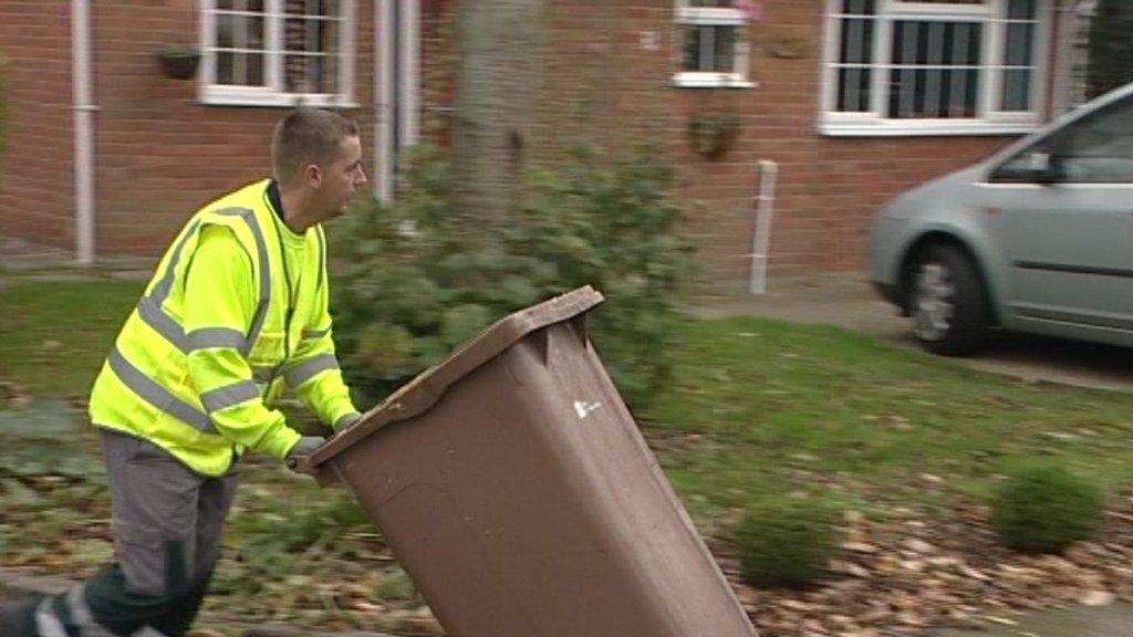 Brown bin being emptied by council worker