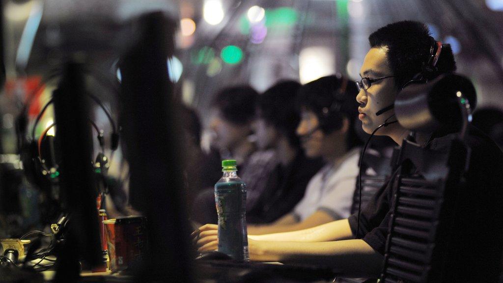 File photo: an internet cafe in Beijing, 12 May 2011