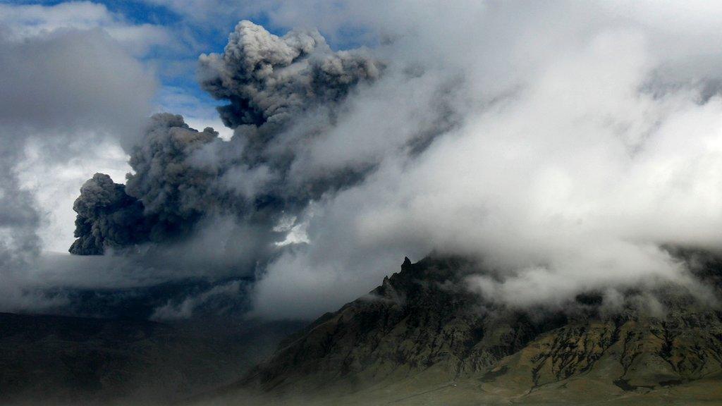 A plume of ash rises from a volcano erupting under the Eyjafjallajokull glacier