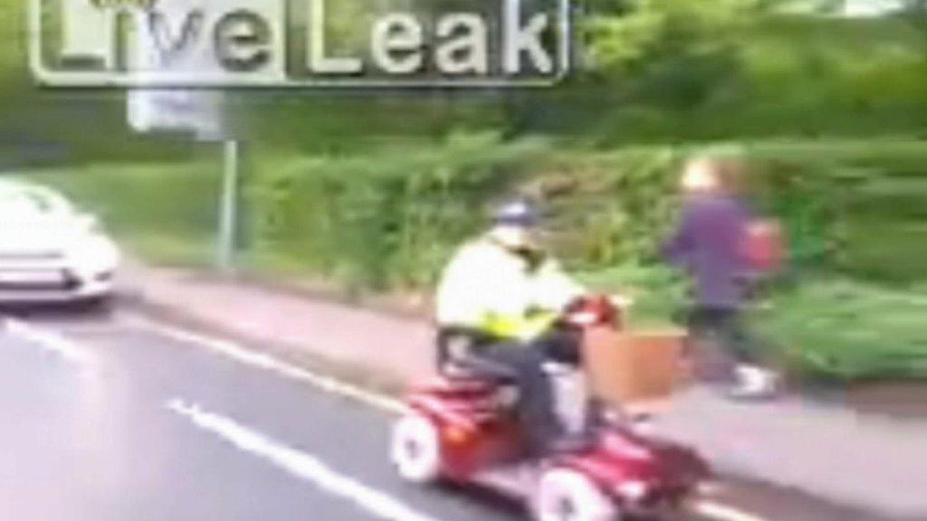 Mobility scooter escorted by Wiltshire police