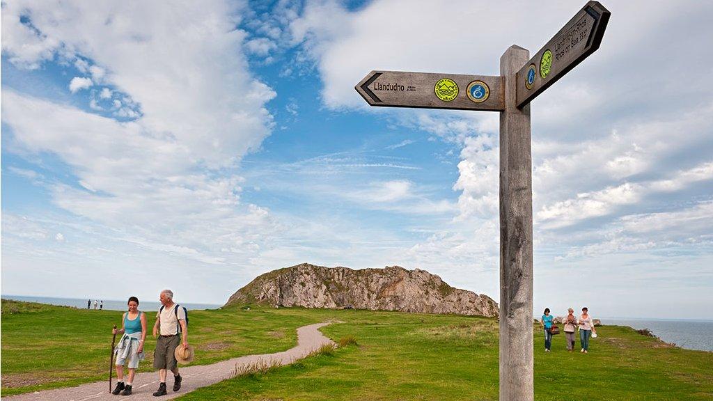 Visitors walking the coastal path