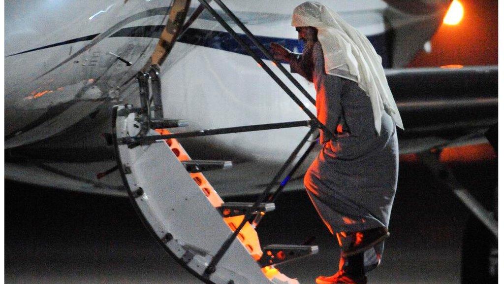 Abu Qatada boarding plane