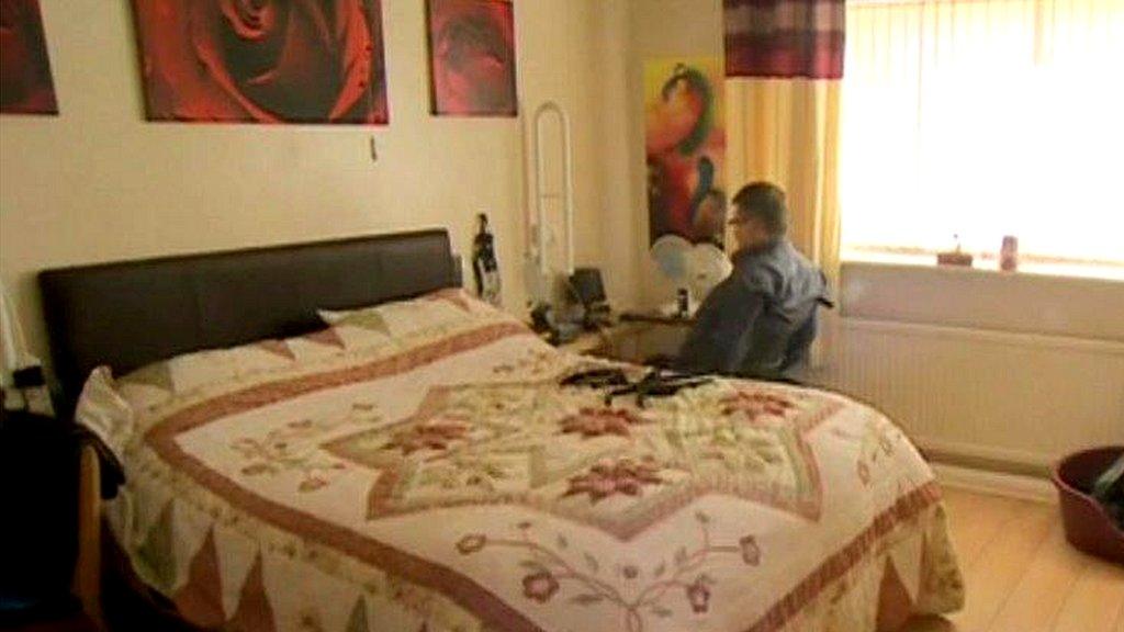 Disabled man in bedroom