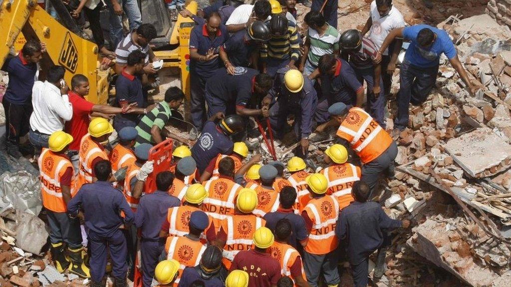 Rescue workers during a search operation for survivors in Vadodara in the western Indian state of Gujarat August 28, 2013