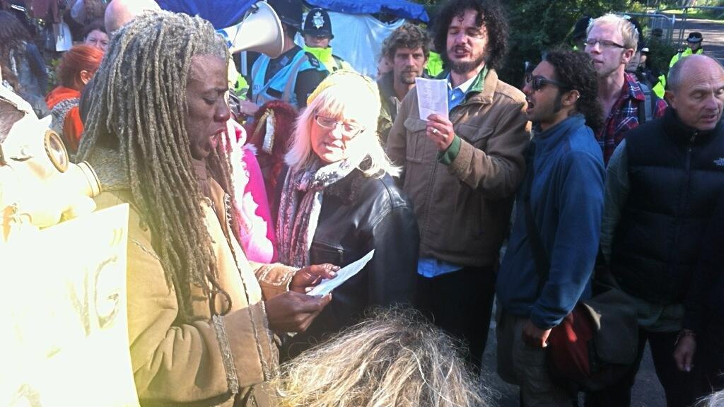 Protesters singing outside the gates