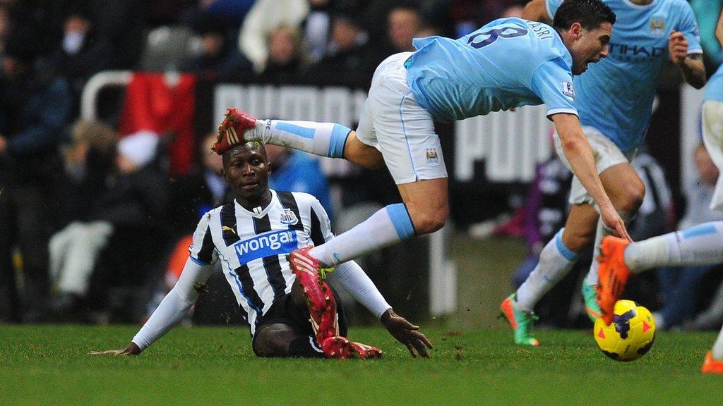 Samir Nasri is challenged by Mapou Yanga-Mbiwa