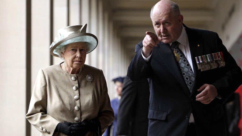 Britain's Queen Elizabeth II (left) is accompanied by retired General Peter Cosgrove, chairman of the Australian War Memorial Board, as she walks the cloisters at the Australian War Memorial in Canberra on 25 October 2011