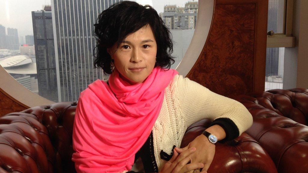 Gigi Chao sits during an interview in her apartment in Hong Kong