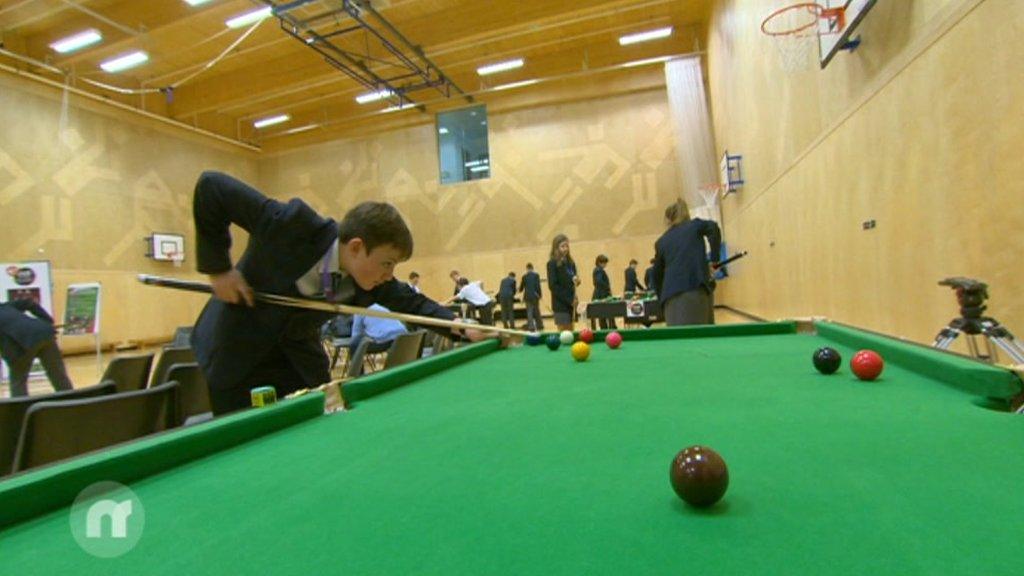 Kids playing snooker