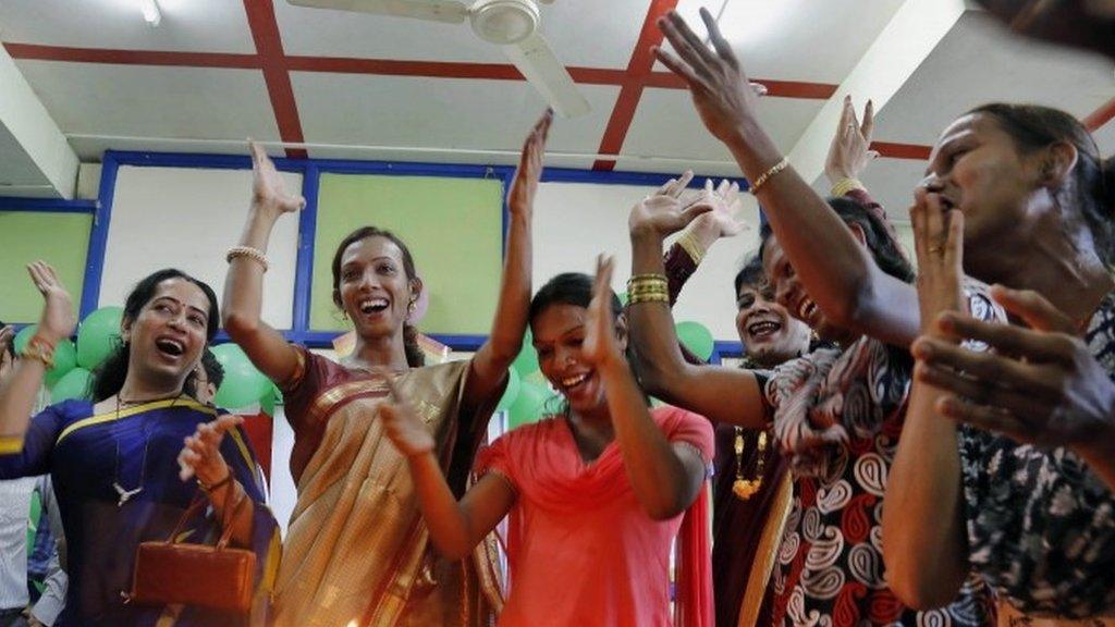 Transgenders celebrate after the Supreme Court’s verdict recognising third gender category, in Mumbai, India, Tuesday, April 15, 2014.