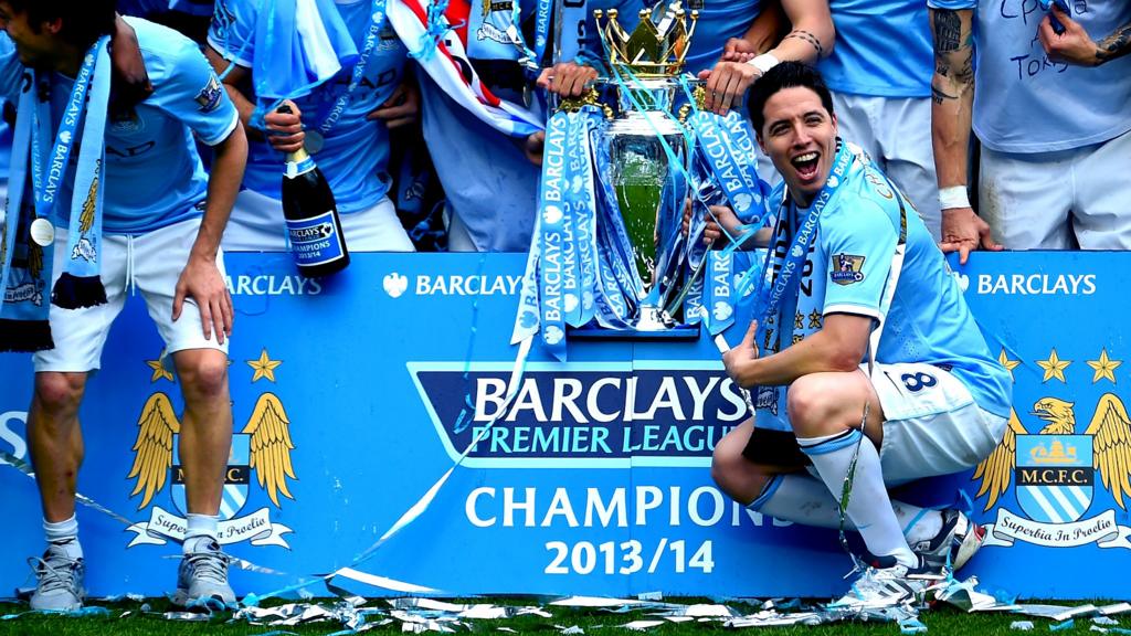 Samir Nasri and the team pose with the trophy