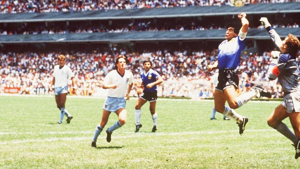 Diego Maradona's hand of god goal is watched by the England defence