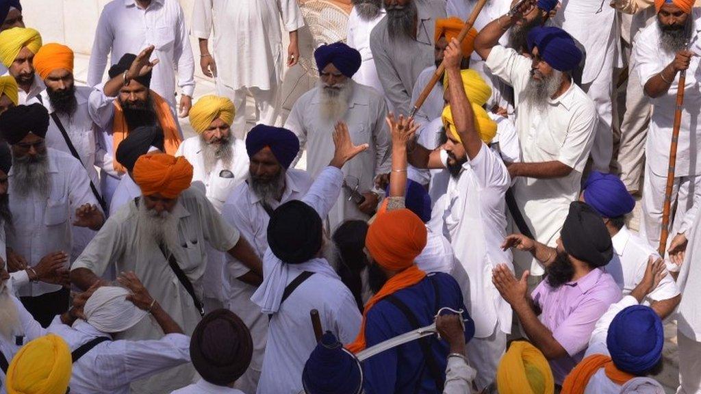 Sikh activists clash with members of the SGPC during commemorations for the 30th anniversary of Operation Blue Star at the Golden Temple in Amritsar on June 6, 2014