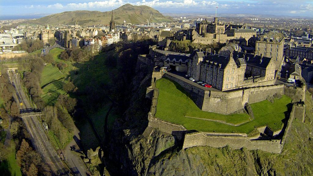 Edinburgh Castle with Arthur's Seat in background.