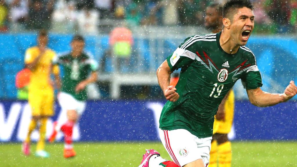 Oribe Peralta celebrates after scoring Mexico's first goal