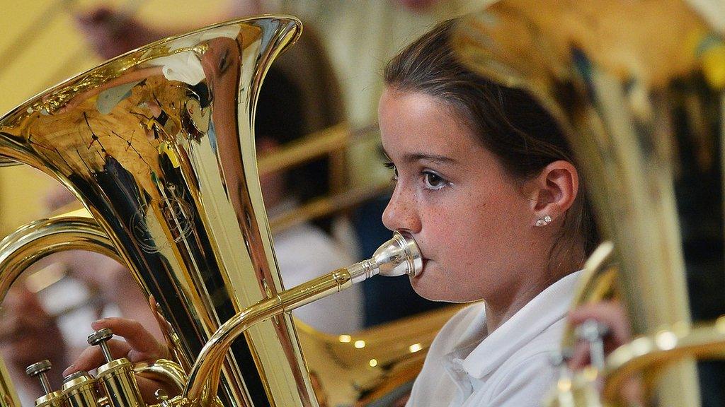 Girl playing in a school orchestra