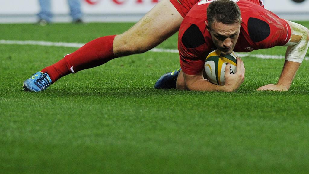 Corey Allen of Wales scores a try