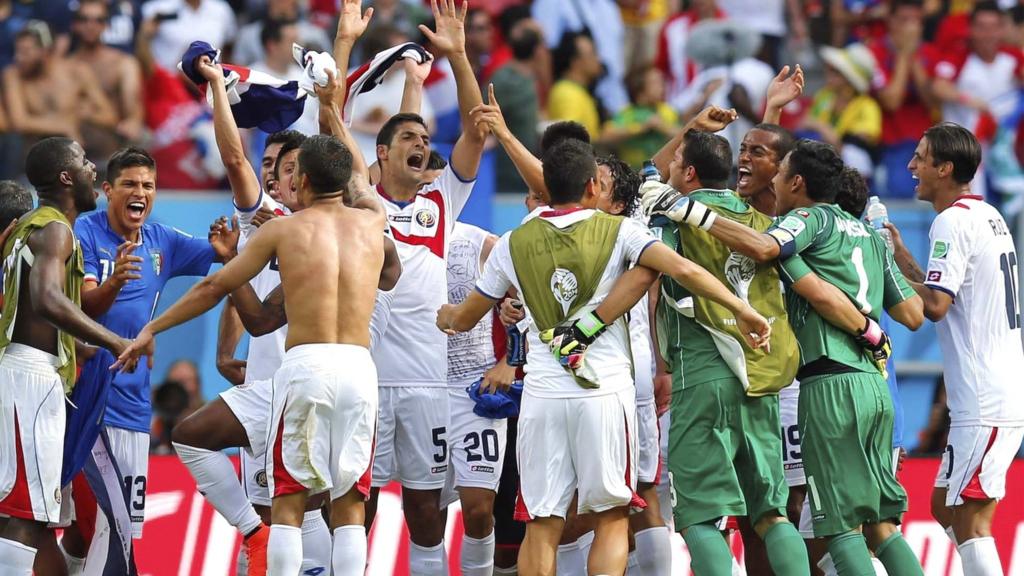 Costa Rican players celebrate after the group D World Cup win over Italy