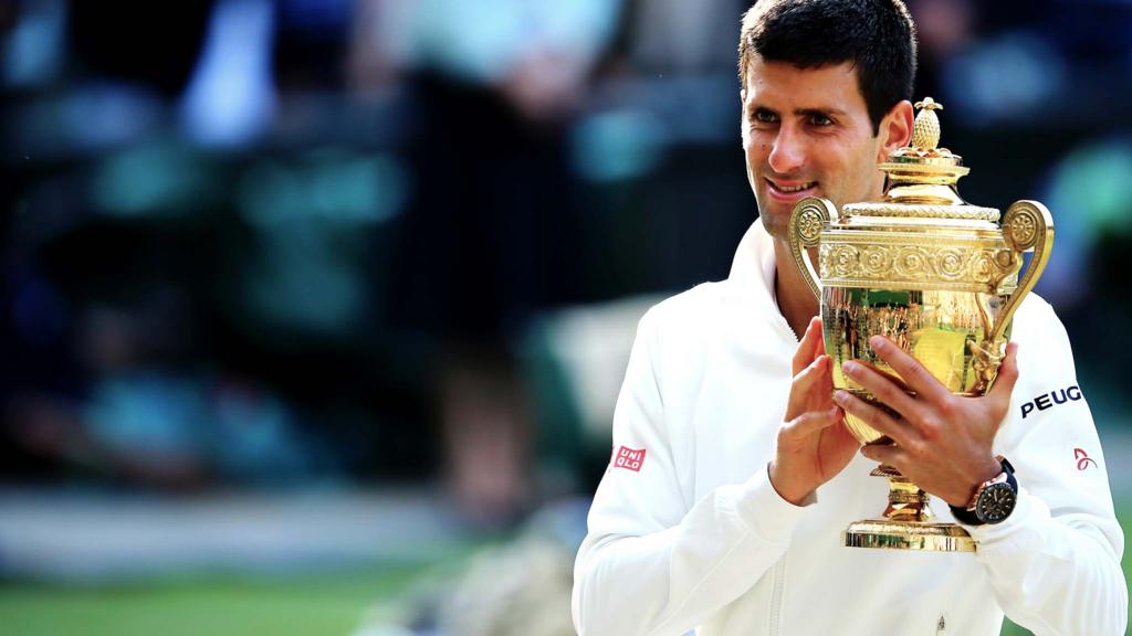 Novak Djokovic of Serbia poses with the Gentlemen's Singles Trophy