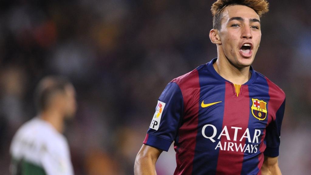 Barcelona's Munir reacts after scoring