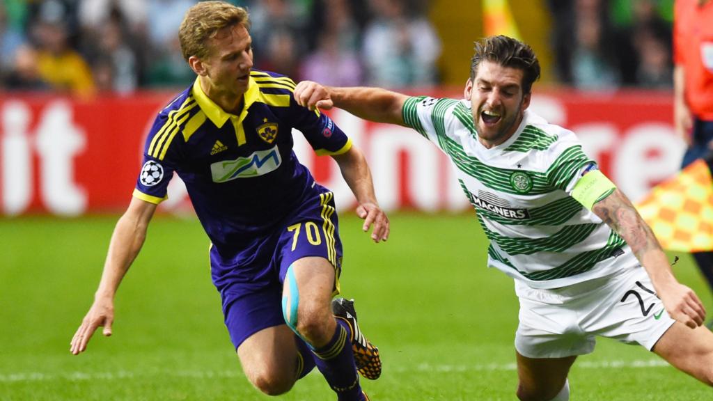 Celtic's Charlie Mulgrew (right) is tackled by Ales Mertelj