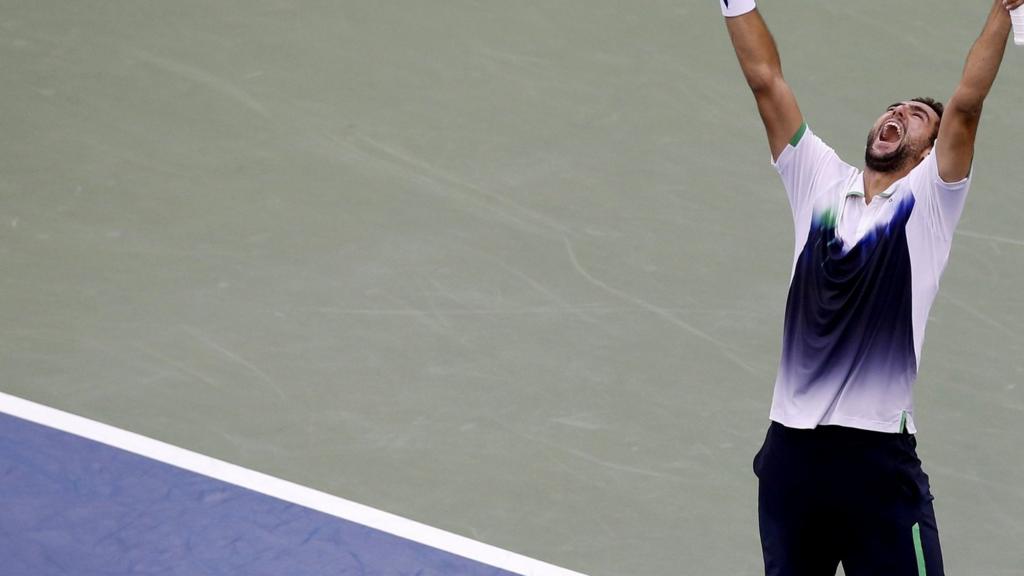 Marin Cilic of Croatia celebrates after defeating Roger Federer