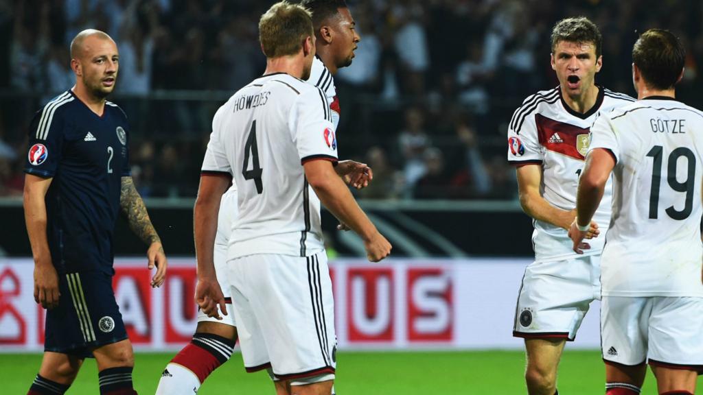 Thomas Mueller of Germany celebrates scoring with teammates