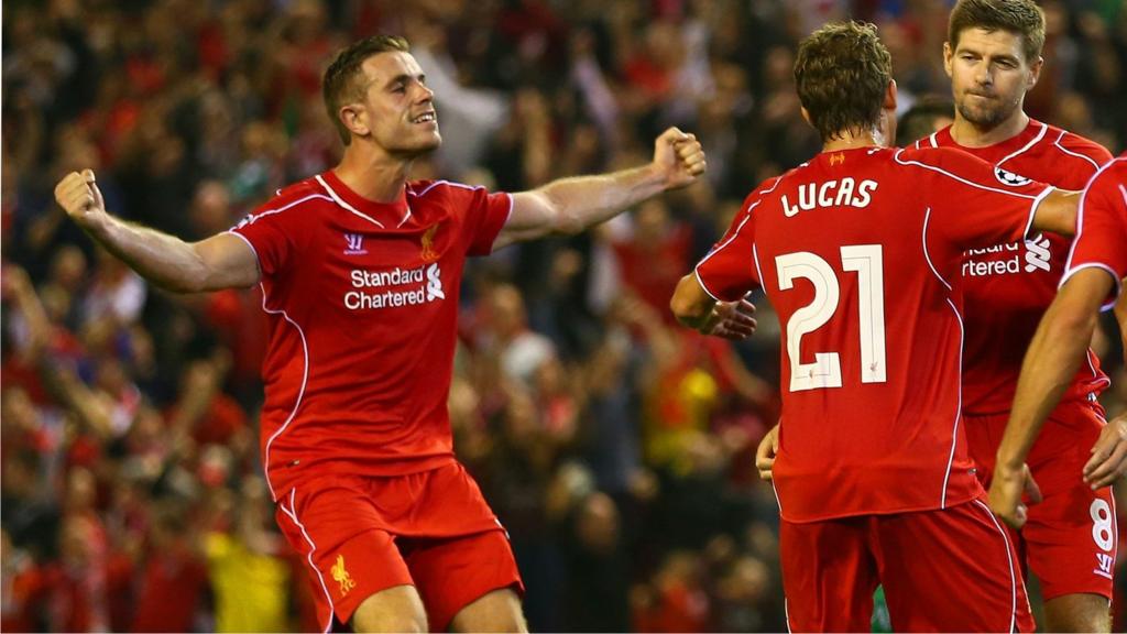 Steven Gerrard of Liverpool celebrates scoring the second goal with teammates