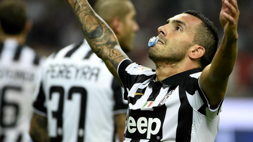 Carlos Tevez celebrates with a dummy