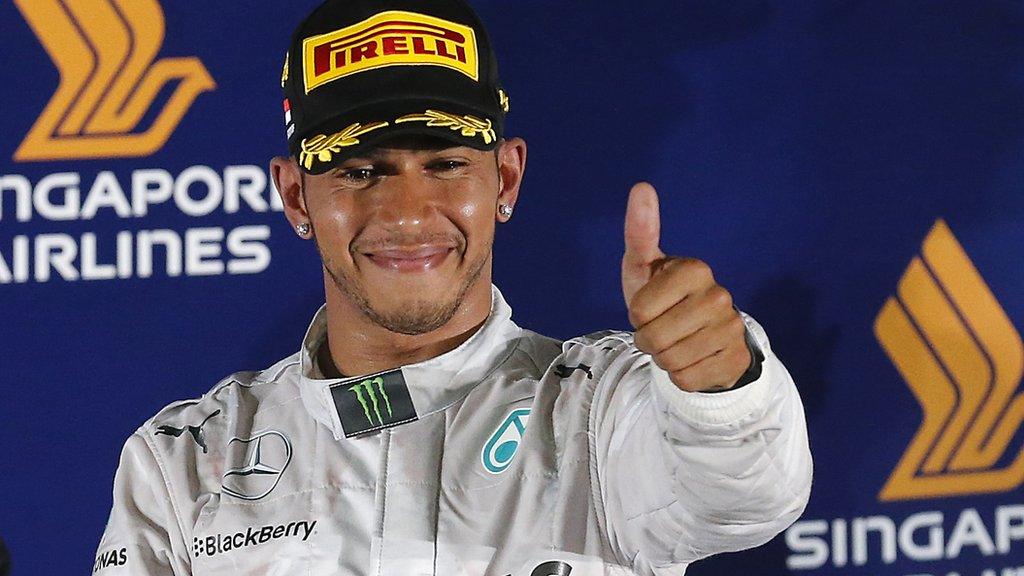 Lewis Hamilton celebrates victory in the Singapore Grand Prix