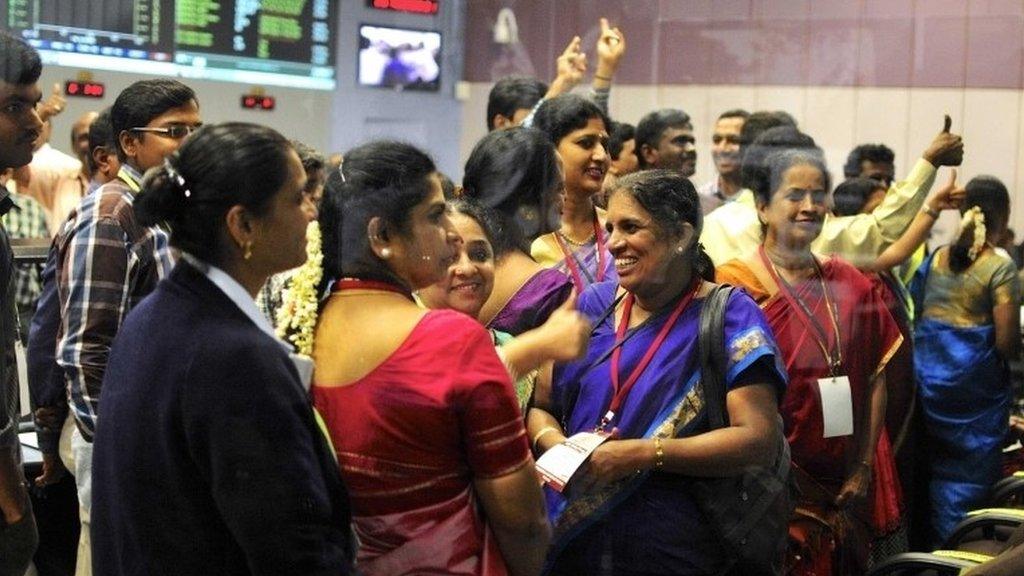 Staff from the Indian Space Research Organisation celebrate after the Mangalyaan probe's entry into orbit around Mars - 24 September 2014