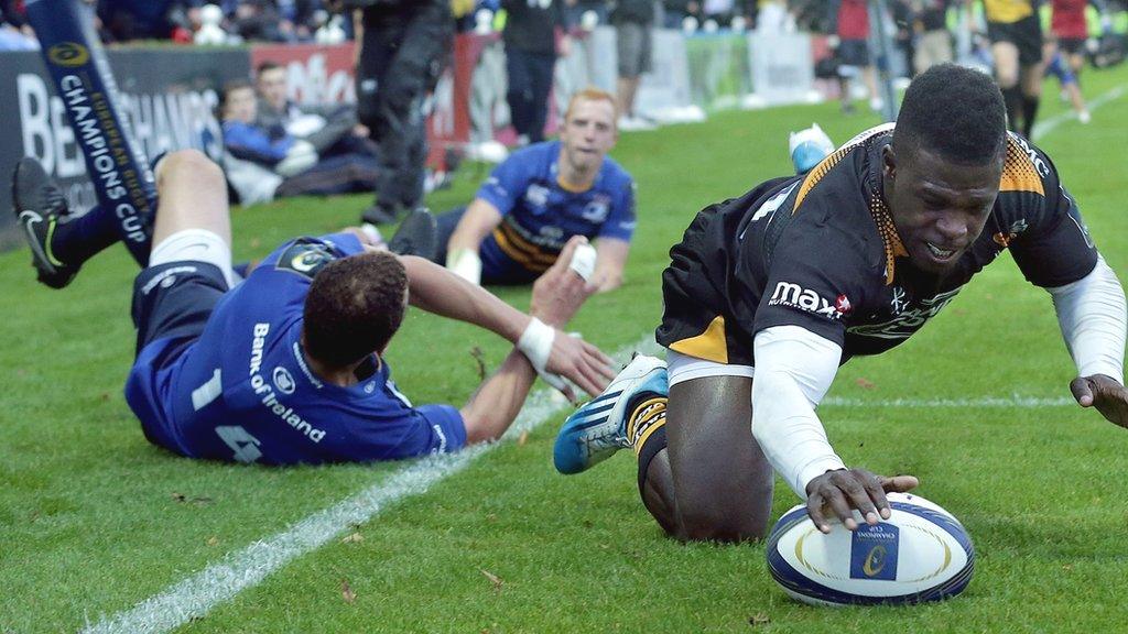 Christian Wade evades the despairing dive of Zane Kirchner to score for Wasps in their Champions Cup defeat by Leinster