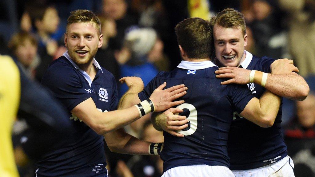 Finn Russell and Greig Laidlaw congratulate Stuart Hogg on his try